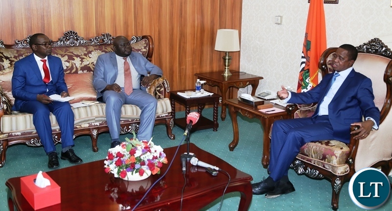 President Edgar Lungu speaking to with Economics Association of Zambia president Dr. Lubinda Habazooka and Vice President Dr. Austin Mwange during the meeting at State House
