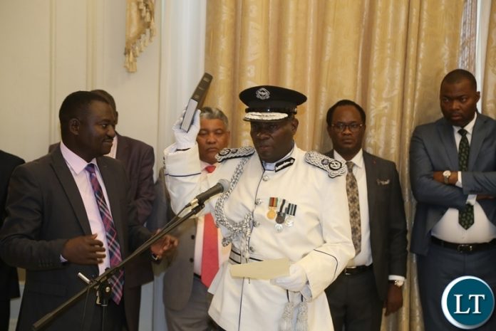 Newly appointed Southern Province Police Commissioner Diamond Likashi taking oath before President Edgar Lungu during swearing in ceremony at State House Newly appointed Southern Province Police Commissioner Diamond Likashi taking oath before President Edgar Lungu during swearing in ceremony at State House