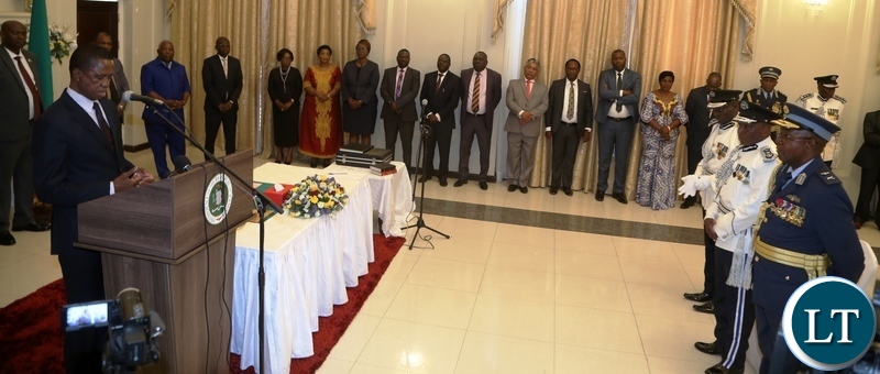 President Edgar Lungu addressing the newly appointed Deputy Zambia Air Force Commander Major General Kapotwe Chintu, Deputy Inspector General of Police Bonny Kapeso and Southern Province Police Commissioner Diamond Likashi during swearing in ceremony at State House