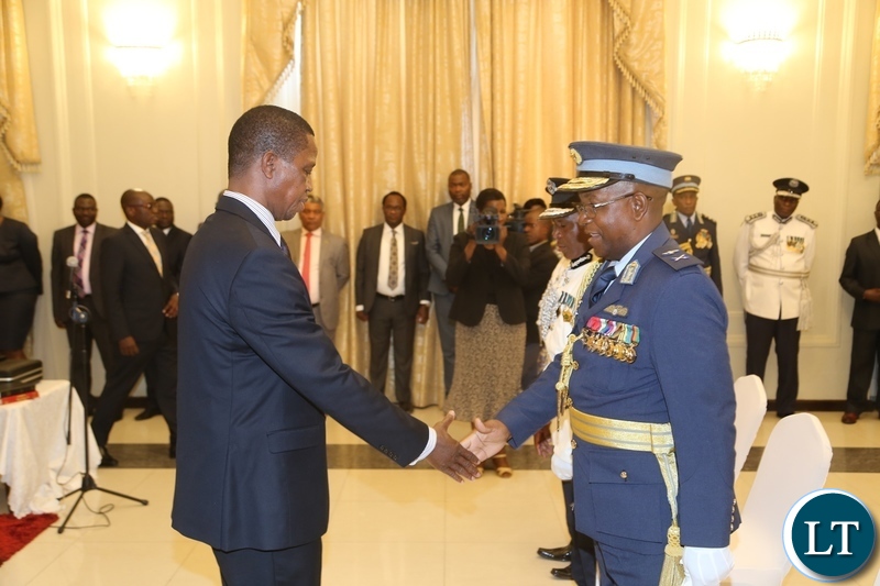 President Edgar Lungu congratulates the newly appointed Deputy Zambia Air Force Commander Major General Kapotwe Chintu shortly after presenting his latter of Oath to the President at State House