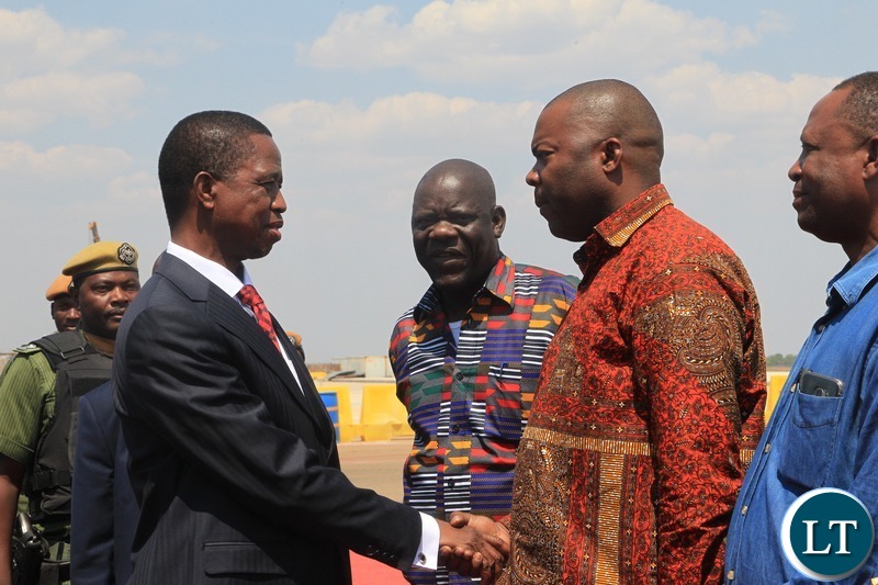 President Edgar Lungu talking to Lusaka Province Minister Bowman Lusambo shortly before departure for Uganda at Kenneth Kaunda International Airport.Picture by SUNDAY BWALYA/ZANIS