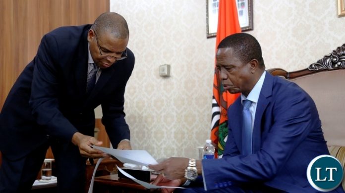 President Edgar Chagwa Lungu (right) receives a report from Bank of Zambia (BOZ) Governor Dr. Denny Kalyalya during a meeting at State House on Tuesday,October 2,2018. PICTURE BY SALIM HENRY/STATE HOUSE ©2018 President Edgar Chagwa Lungu (right) receives a report from Bank of Zambia (BOZ) Governor Dr. Denny Kalyalya during a meeting at State House on Tuesday,October 2,2018. PICTURE BY SALIM HENRY/STATE HOUSE ©2018