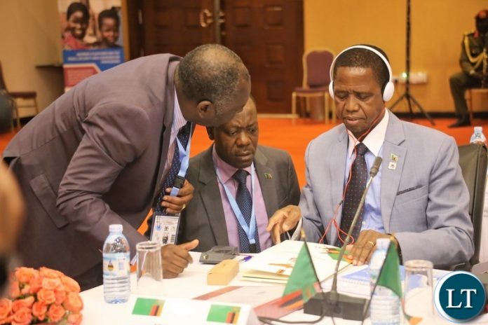 President Lungu consulting with his Defence Minister, Hon. Davies Chama and Special Assistant to the President for Politics, Kaiser Zulu before the official opening of the 9th summit of the Regionaloversight mechanism of peace, security and cooperation frame work for Congo DR President Lungu consulting with his Defence Minister, Hon. Davies Chama and Special Assistant to the President for Politics, Kaiser Zulu before the official opening of the 9th summit of the Regionaloversight mechanism of peace, security and cooperation frame work for Congo DR