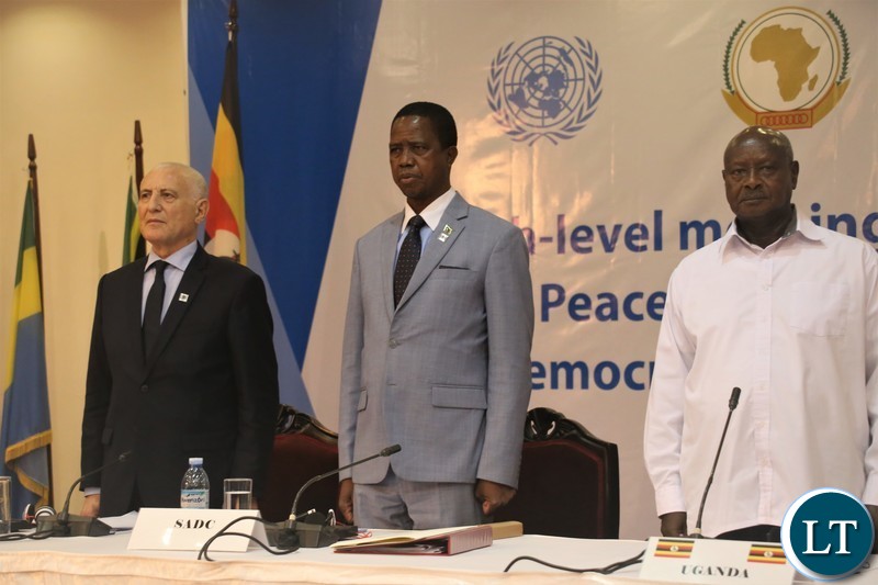 Presidents Lungu and Museveni and UN Secretary-General's Special Envoy to the Great Lakes Region, Mr.Said Djinit during the singing of the Uganda National Anthem before the official opening of the 9th summit of the Regionaloversight mechanism of peace, security and cooperation frame work for Congo DR