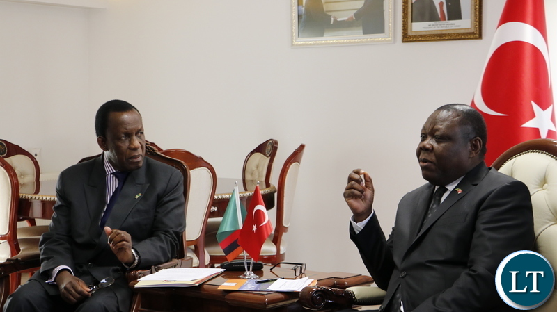 Zambia's Ambassador to the Republic of Turkey, Dr Joseph Chilengi confers with Electoral Commission of Zambia chairperson Honourable Justice Esau Chulu at the Zambian Chancery in Ankara