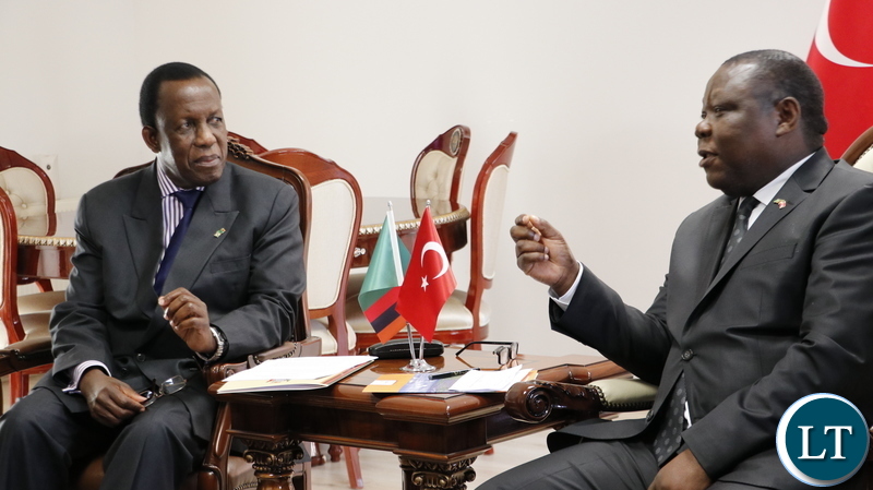 Zambia's Ambassador to the Republic of Turkey, Dr Joseph Chilengi confers with Electoral Commission of Zambia chairperson Honourable Justice Esau Chulu at the Zambian Chancery in Ankara