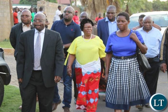 Prof Luo leaving the funeral house after she was chased by UNZA students