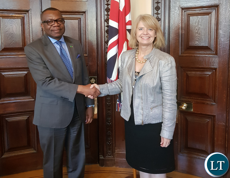 Minister Harriett Baldwin shake hands with High Commissioner Chikonde after a meeting at her office.