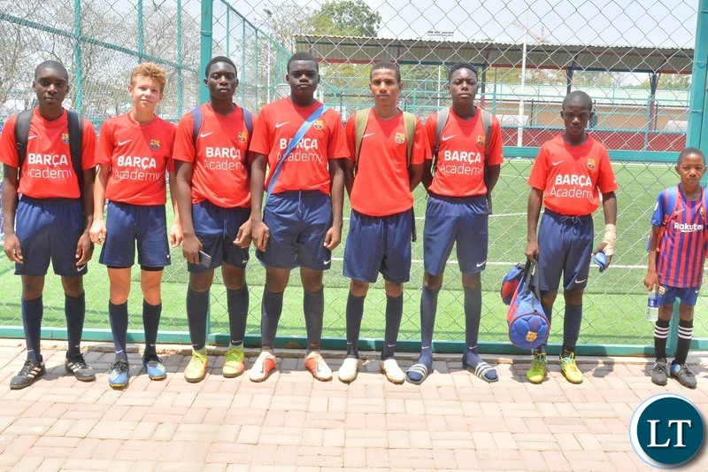 Barcelona soccer academy team pose for a photograph during the Launch of futsal and sports complex in Lusaka.