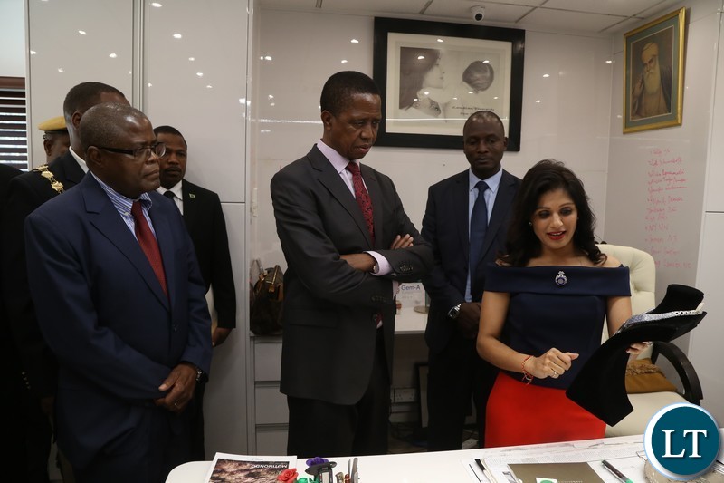 Jewel of Africa partner Mrs Rashein Shamaa explains to President Edgar Lungu while Commerce Minister Christopher yaluma listerns when he toured JOA offices in lusaka