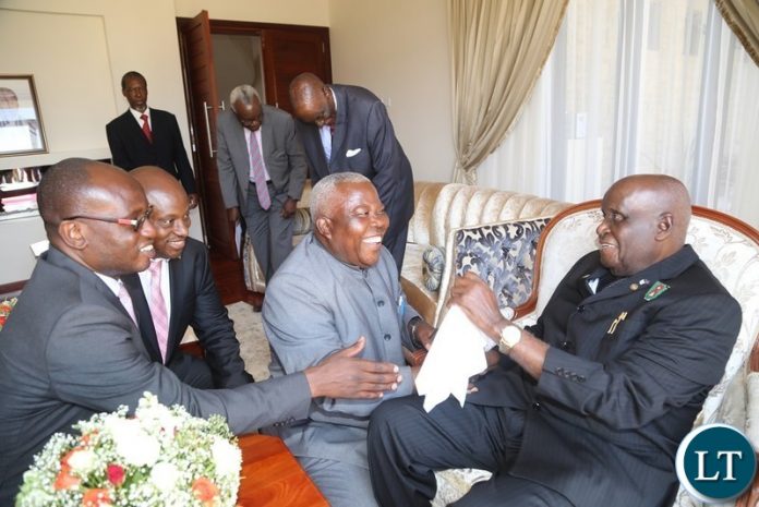 First Republican President Dr. Kenneth Kaunda having a light moment with Presidential Affairs Minister Freedom Sikazwe, Special Assistant to the President for Press and Public Relations Amos Chanda and Special Assistant to the President for Project, monitoring and Implementation Andrew Challah during the handover ceremony of the House to the 4th Republican President Rupiah Banda at Bonaventure First Republican President Dr. Kenneth Kaunda having a light moment with Presidential Affairs Minister Freedom Sikazwe, Special Assistant to the President for Press and Public Relations Amos Chanda and Special Assistant to the President for Project, monitoring and Implementation Andrew Challah during the handover ceremony of the House to the 4th Republican President Rupiah Banda at Bonaventure