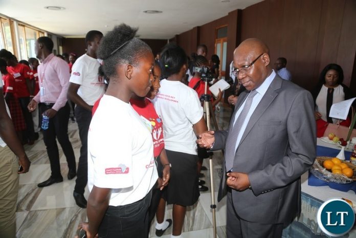 Ministry of Sports Permanent Secretary Joe Kapembwa interacts with children during Launch National Children Symposium at Mulungushi International Conference Centre Ministry of Sports Permanent Secretary Joe Kapembwa interacts with children during Launch National Children Symposium at Mulungushi International Conference Centre