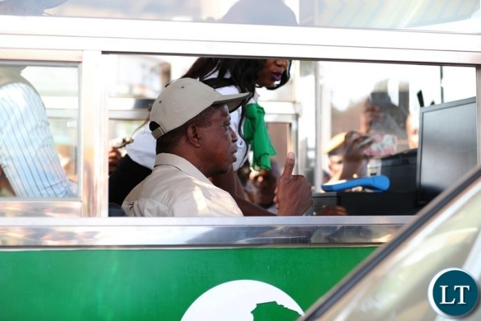 President Edgar Lungu serving a motorist at the newly commissioned Michael Chilufya Toll Plaza on Sunday, 4th November, 2018, Picture by Eddie Mwanaleza.