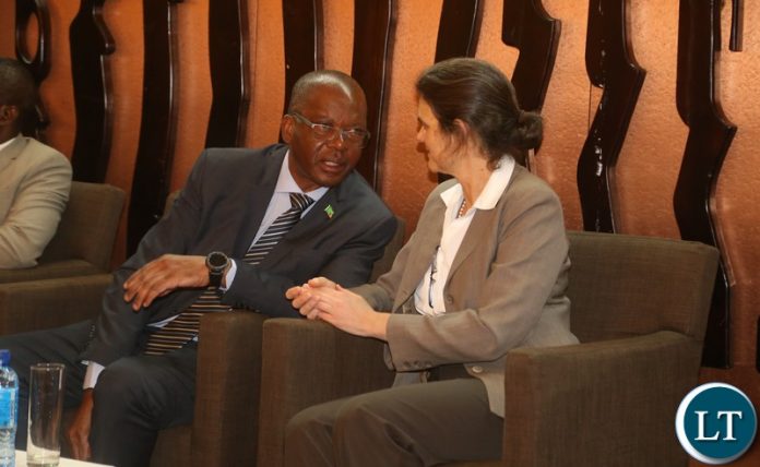 Minister of Energy Mathews Nkhuwa confers with World Bank Practice Manager, Energy and Extractives, Africa Wendy Hughes