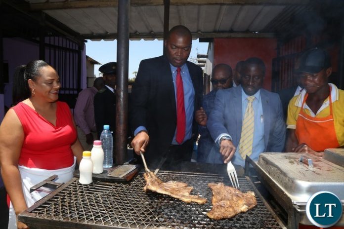 Lusaka Province Minister Bowman Lusambo (c) laid a team of experts from Lusaka city council to inspect the Matebeto Market in Lusaka