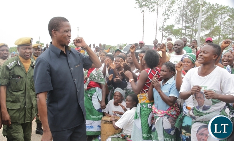 resident Edgar Lungu flashes the party symbol when he arrived at Mansa Airport enroute to Lupososhi District for campaign rallies