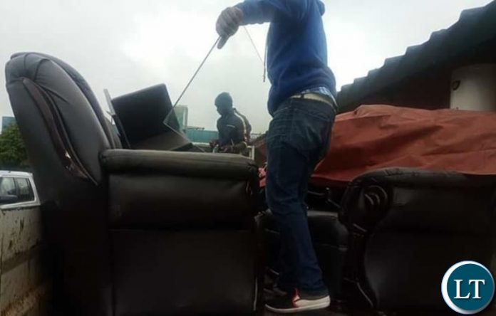 Bailiffs loading the household items seized from Mr Tayali’s house