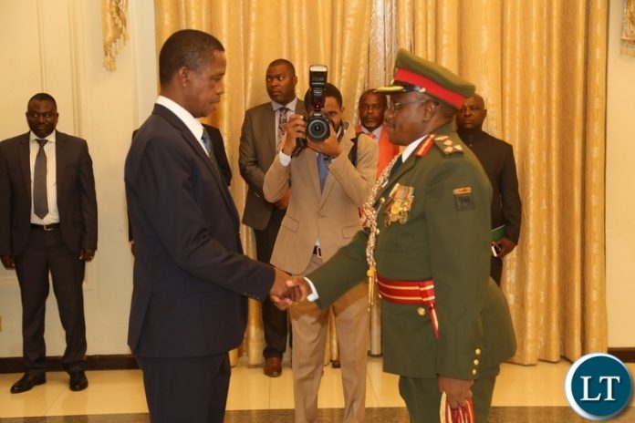 President Edgar Lungu congratulates the Newly appointed Zambia Army Commander Lt. Gen. William Sikazye shortly after taking Oath before President Edgar Lungu at State House President Edgar Lungu congratulates the Newly appointed Zambia Army Commander Lt. Gen. William Sikazye shortly after taking Oath before President Edgar Lungu at State House