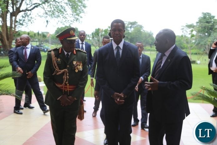President Edgar Lungu confers with the Newly appointed Zambia Army Commander Lt. Gen. William Sikazye (l) and Defence Minister Davies Chama (r) shortly after the swearing in ceremony at State House President Edgar Lungu confers with the Newly appointed Zambia Army Commander Lt. Gen. William Sikazye (l) and Defence Minister Davies Chama (r) shortly after the swearing in ceremony at State House