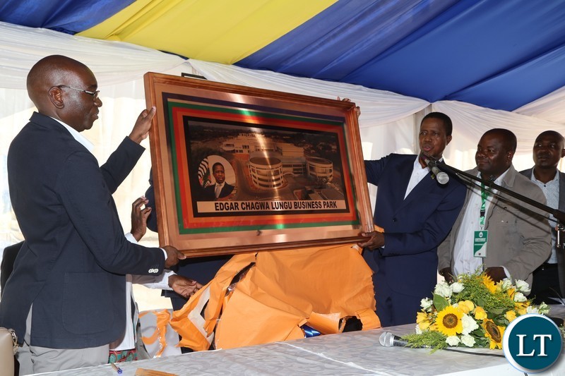 President Edgar Lungu receives a gift from NAPSA Managing Director Yoland Kachinda after he officially opened the Edgar Chagwa Mall in Kitwe