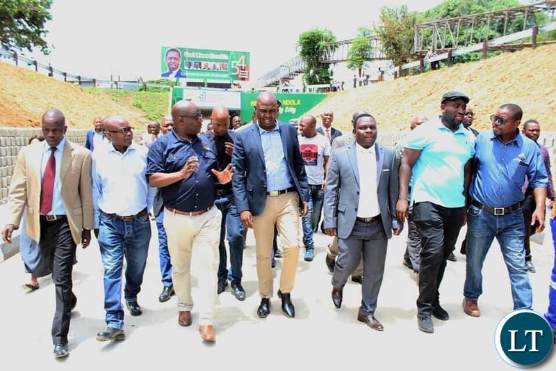 Copperbelt province Minister Japhen Mwakambe officially re-opening part of the road on Dag Hammersjoid commonly known as the under bridge