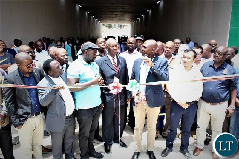 Copperbelt province Minister Japhen Mwakambe officially re-opening part of the road on Dag Hammersjoid commonly known as the under bridge
