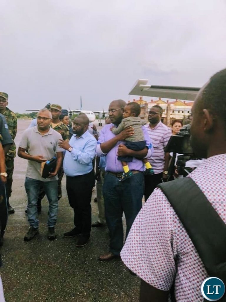 Minister of Health Chitalu Chilufya with the boy before being evacuated to Lusaka's UTH