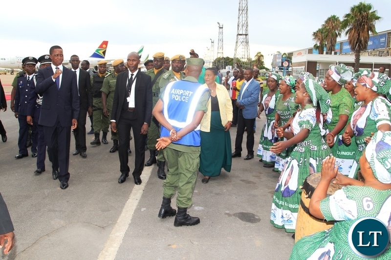 President Edgar Lungu watches some dances by PF women's group before departure for Japan at Kenneth Kaunda International Airport