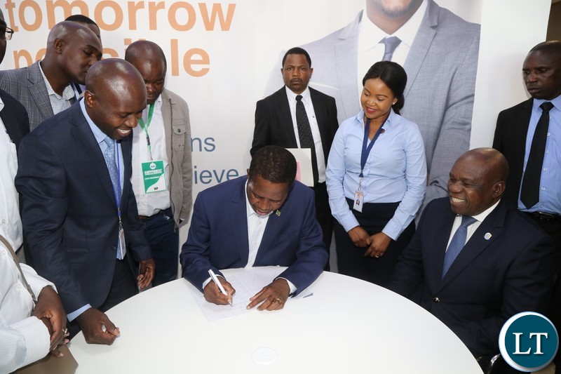 President Edgar Lungu opening an account with Zambia Industrial Bank before he officially opened the Edgar Chagwa Mall in Kitwe