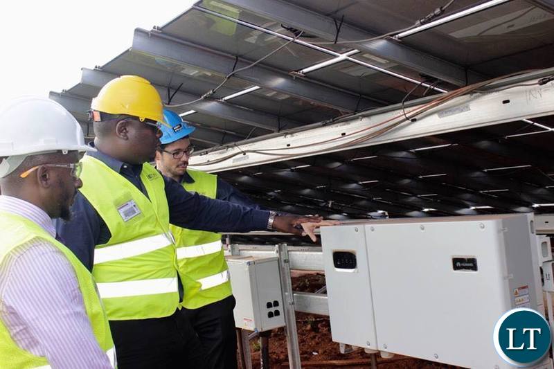 IDC Group CEO Mr Mateyo Kaluba inspecting the Solar Energy Plant