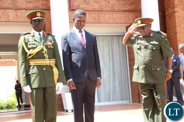 Zambia Army Commander Lt. Gen. William Sikazwe salute to President Edgar Lungu whilst the Newly appointed Zambia Army Deputy Commander Major. Gen. Dennis Alibuzwi looks on shortly after swearing in Ceremony at State House Zambia Army Commander Lt. Gen. William Sikazwe salute to President Edgar Lungu whilst the Newly appointed Zambia Army Deputy Commander Major. Gen. Dennis Alibuzwi looks on shortly after swearing in Ceremony at State House