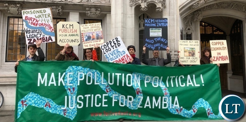 Environmental activists from Foil Vedanta hold a banner outside the Supreme Court in London, demanding justice for pollution by a British copper mining company in Zambia Photo-Samarendra Das-Foil Vedanta