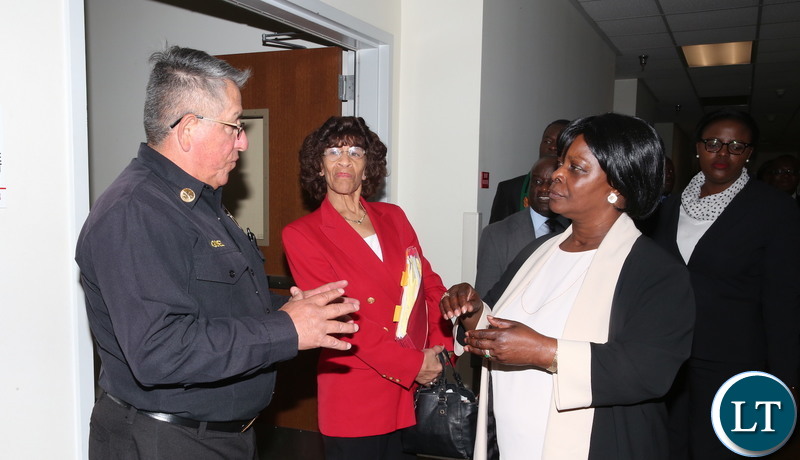 First Lady Esther Lungu listens to Los Angeles Fire Department Battalion Chief Ray Gomez (L) during a tour of Los Angeles Fire Department- Fire Station 4 in California, United States of America on Tuesday, January 22,2019-Pictures by THOMAS NSAMA