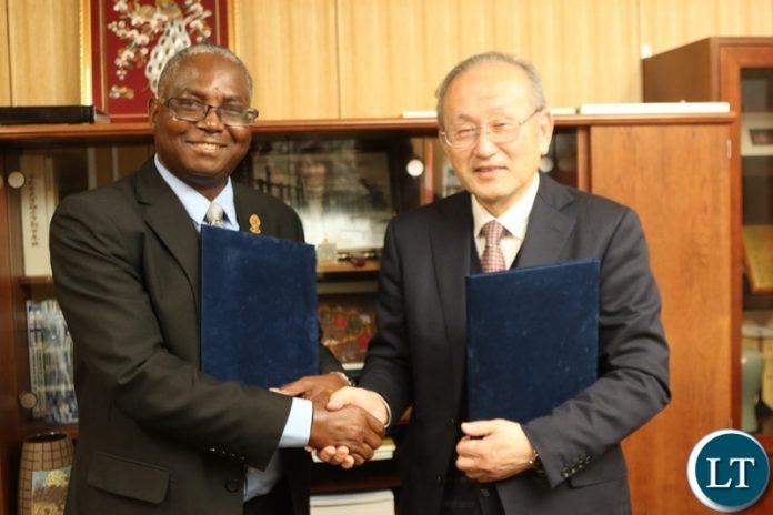 Pictured at Gifu University UNZA Vice Chancellor Professor Luke Mumba exchanging the partnership agreement with the Gifu University Dean of the Faculty of Engineering Prof Toshiaki Murai Pictured at Gifu University UNZA Vice Chancellor Professor Luke Mumba exchanging the partnership agreement with the Gifu University Dean of the Faculty of Engineering Prof Toshiaki Murai