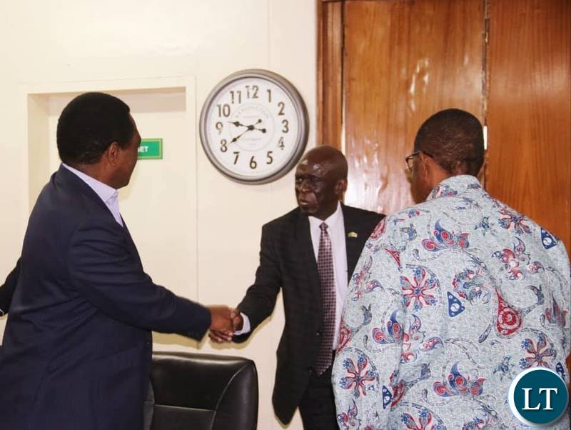 UPND leader Hakainde Hichilema meeting with ECZ Deputy commission chairperson,Commissioner Ali Simwinga, while GBM looks on