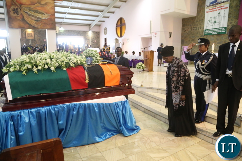 Acting President Inonge Wina paying her last respect to the late Maj. Gen. Kapotwe Chintu at the Cathedral Child Jesus during the funeral church service