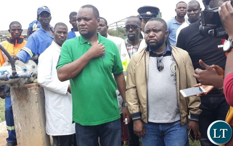 Lusaka Mayor Miles Sampa doing the on the spot check of water samples in the affected areas