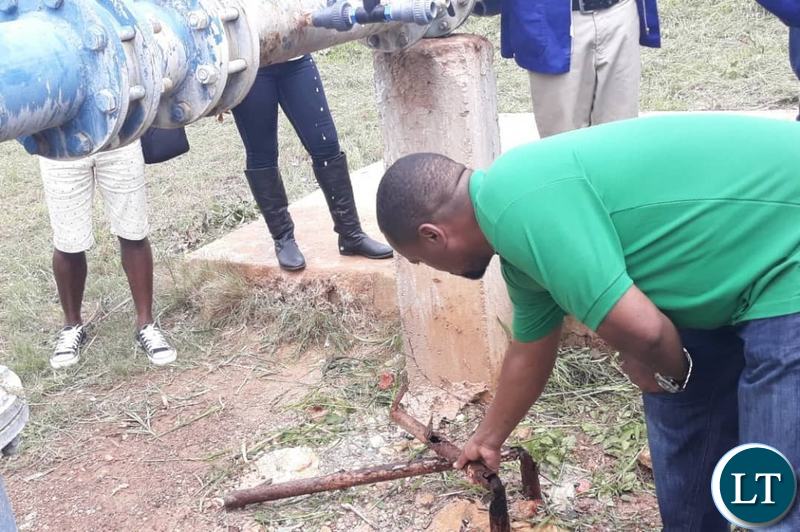 Lusaka Mayor Miles Sampa doing the on the spot check of water samples in the affected areas
