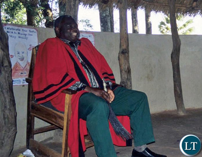 Mwanachingwala with a Fly Whisk