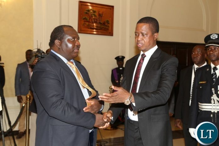 President Edgar Lungu talks to newly sworn inn Ministry of Agriculture Permanent Secretary Songowayo Zyambo at State House President Edgar Lungu talks to newly sworn inn Ministry of Agriculture Permanent Secretary Songowayo Zyambo at State House
