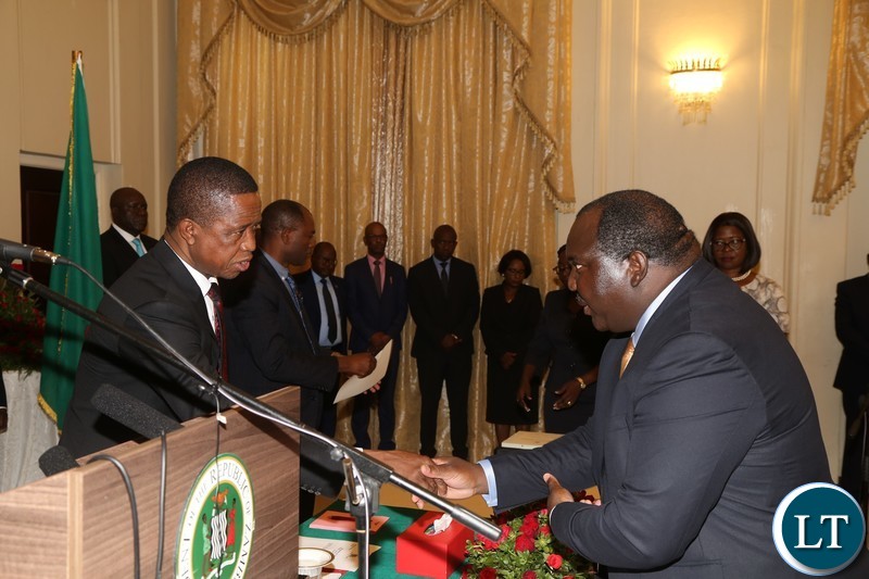 President Edgar Lungu congratulates newly sworn inn Ministry of Agriculture Permanent Secretary Songowayo Zyambo at State House