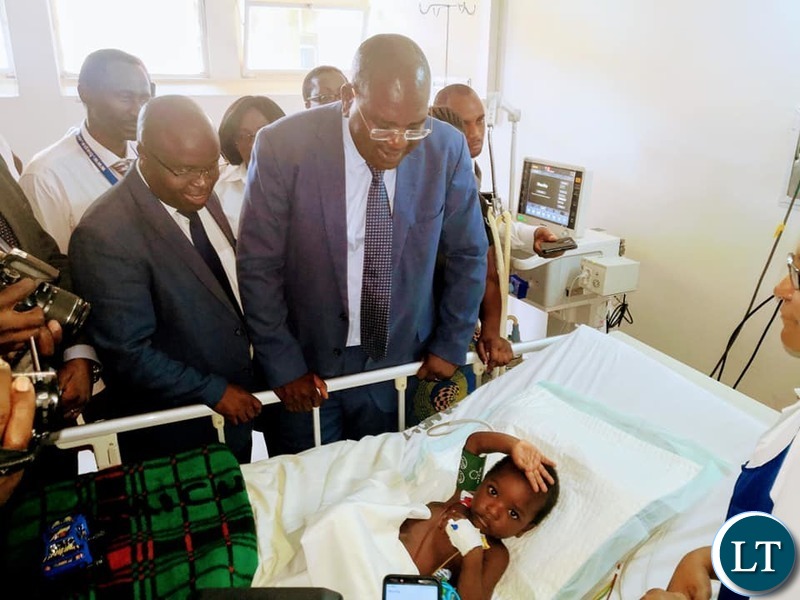 Minister of Health Dr. Chitalu Chilufya visiting the recovering Richard Zulu