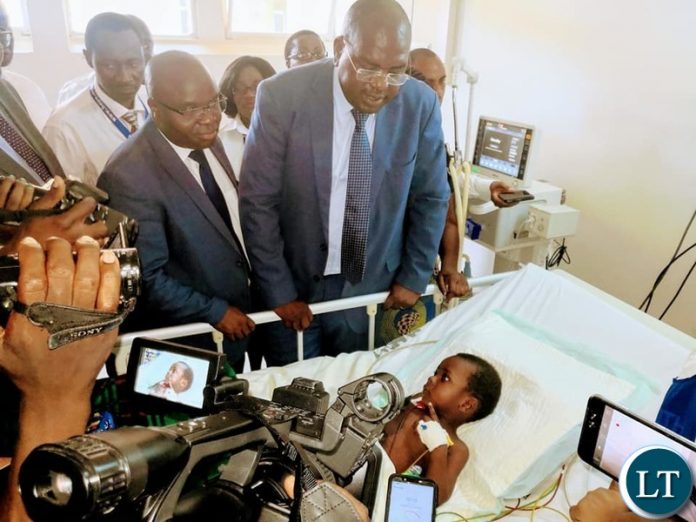 Minister of Health Dr. Chitalu Chilufya visiting the recovering Richard Zulu