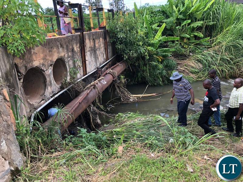 Housing and Infrastructure Development Minister Ronald Chitotela inspecting the damage