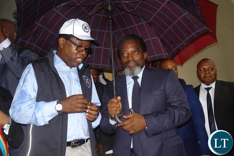 Head of the SADC Observer Mission in the Democratic Republic of Congo, and Zambia's Minister of Forrign Affairs Hon. Joseph Malanji led a team to observe the casting of votes. In the Picture , the Minister with outgoing President Joseph Kabila