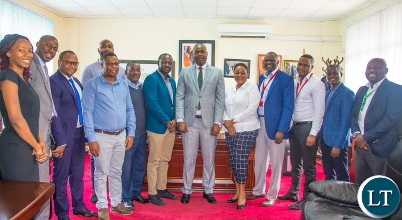Lusaka Province Minister Bowman Lusambo meeting mobile money both operators in his office