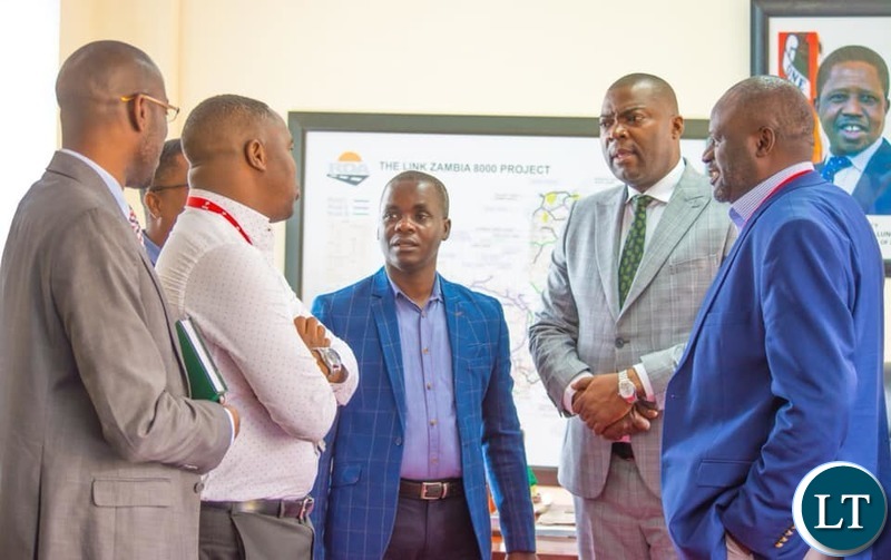 Lusaka Province Minister Bowman Lusambo meeting mobile money both operators in his office