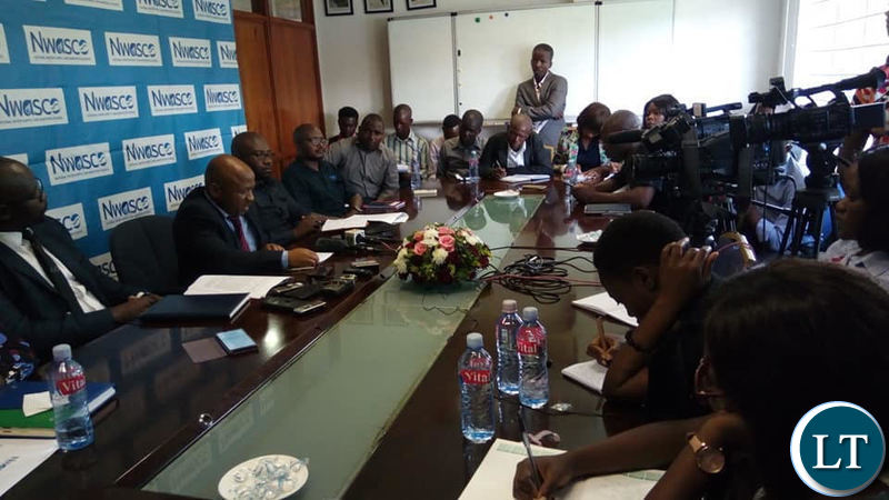 National Water and Sanitation Council Acting Director Eng. Peter Mutale (C) addressing a media briefing