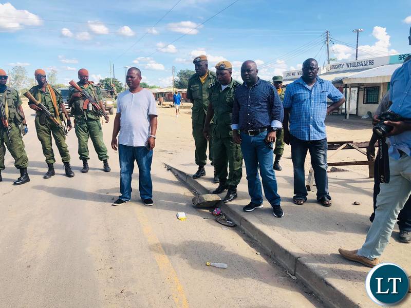 Home Affairs Minister conducting an assessment on the extent of the damage on goods and property resulting from an attack on marketeers and residents