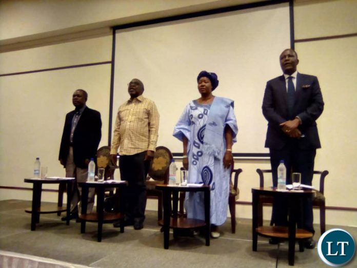 MMD faction President Felix Mutati, FDD President Edith Nawakwi, ULP President Sakwiba Sikota and Raimbow Party leader Wynter Kabimba sign the national anthem at the start of a press briefing at Pamodzi Hotel.